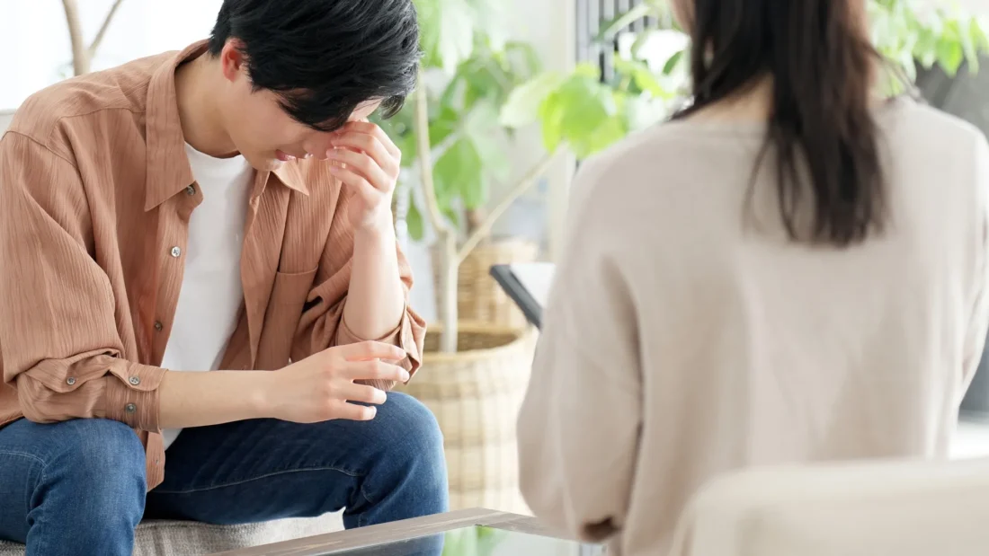 Counsellor and client in a private one-on-one therapy session focused on emotional support and mental health